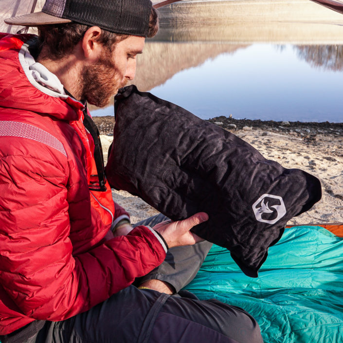 Sam blowing up Foxelli camping pillow