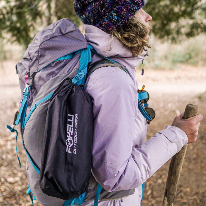 Foxelli camping pillow attached to Yaiza's backpack