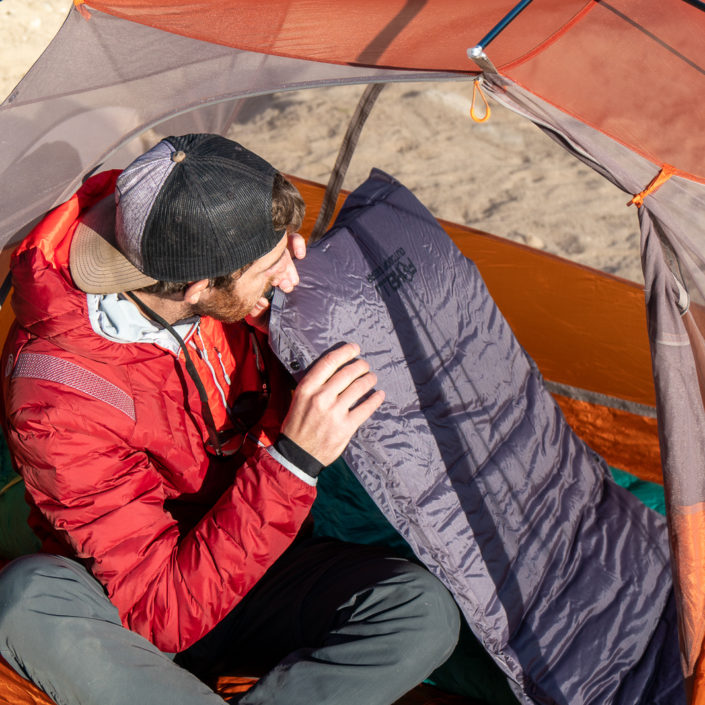 Sam blowing up Foxelli camping pad