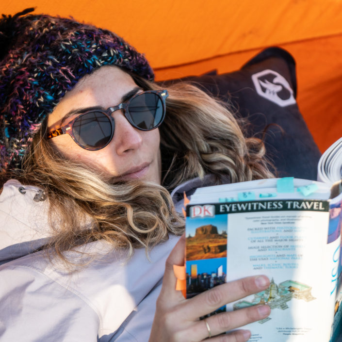 Yaiza reading with Foxelli camping pillow